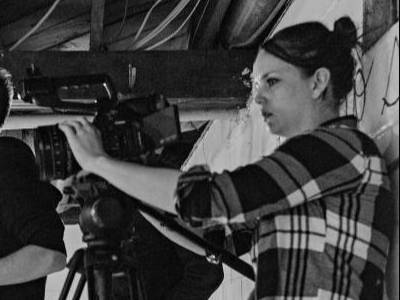 woman using a film camera